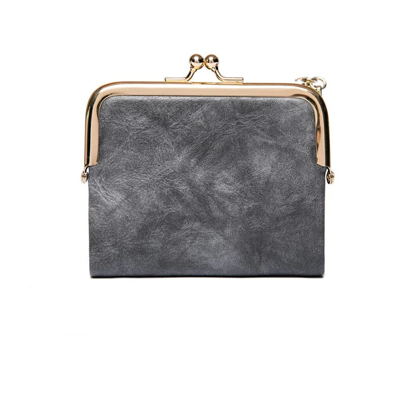 Graues Lederportemonnaie mit goldfarbenem Metallrahmen, elegantes Design, Damenaccessoire.