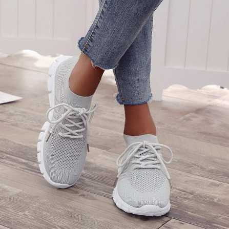 Graue Damen-Sneaker aus Mesh, bequem, atmungsaktiv, ideal für Freizeit und Sport.