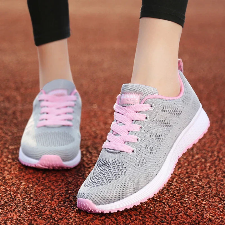 Graue Damen-Sneaker mit rosa Schnürsenkeln, atmungsaktiv, leicht, für Outdoor-Aktivitäten.