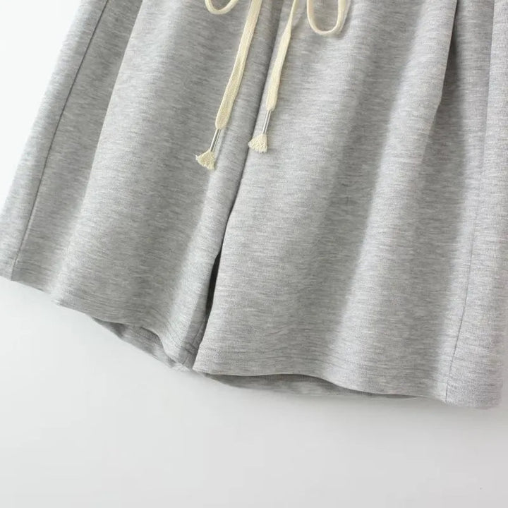 Graue Jogginghose aus Baumwolle mit Kordelzug, bequeme Sportbekleidung für Damen.