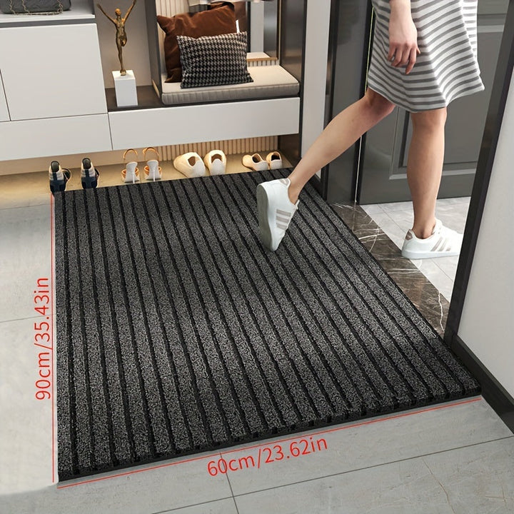 Graue rutschfeste Fußmatte im Flur, 90x60 cm, ideal für Eingangsbereich, moderne Inneneinrichtung.