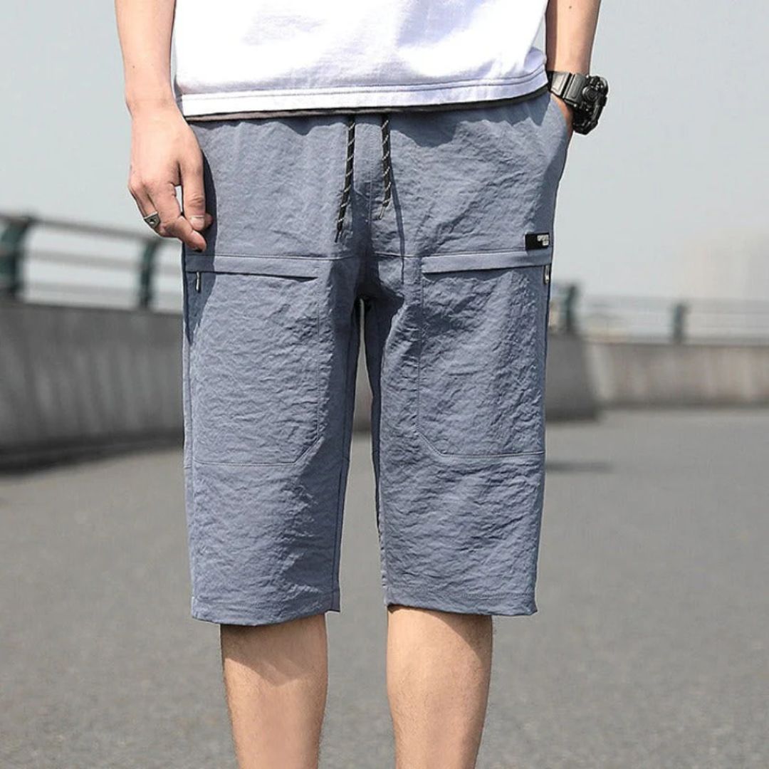 Graue Herren-Shorts aus Baumwolle, knielang, mit Taschen, ideal für Sommermode.