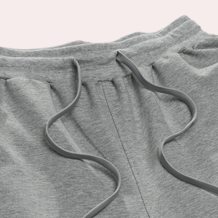Graue Jogginghose aus Baumwolle mit Kordelzug, bequeme Sportbekleidung für Herren.