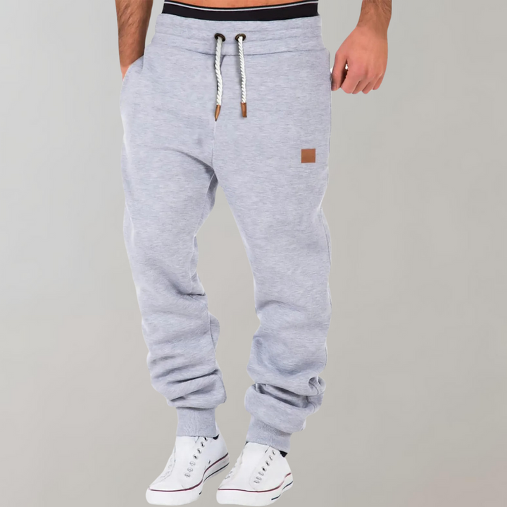 Graue Herren-Jogginghose mit Kordelzug, bequem, sportlich, Baumwolle, ideal für Freizeit.