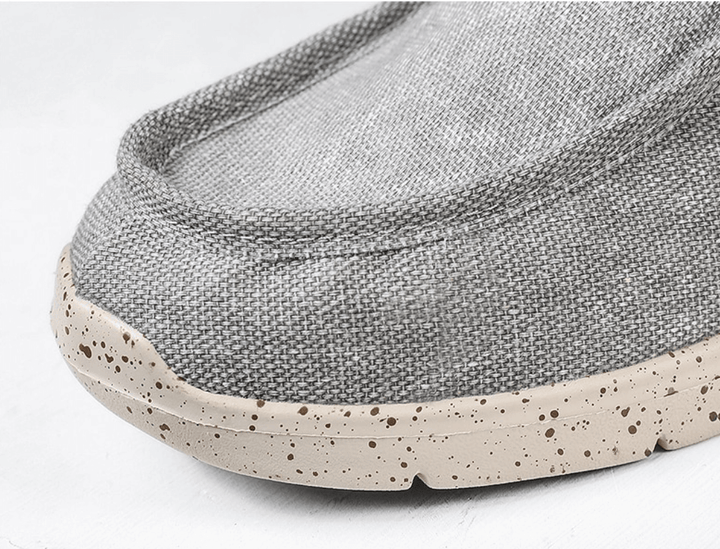 Graue Leinen-Loafer mit gesprenkelter Sohle, bequeme Freizeitschuhe für Herren.