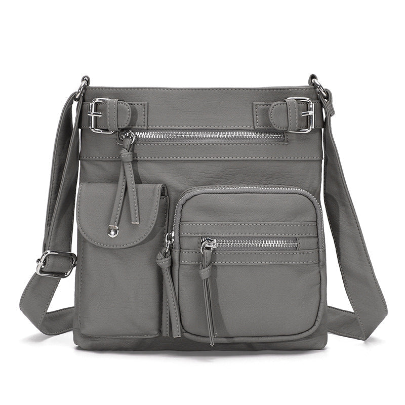 Graue multifunktionale Anti-Diebstahl-Tasche, modisch, mit Reißverschlüssen und Fächern.