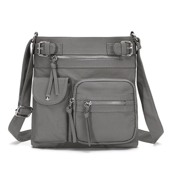 Graue multifunktionale Anti-Diebstahl-Tasche, modisch, mit Reißverschlüssen und Fächern.