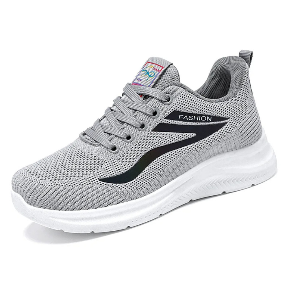 Graue Sportschuhe mit weicher Sohle, atmungsaktives Mesh, modisches Design.