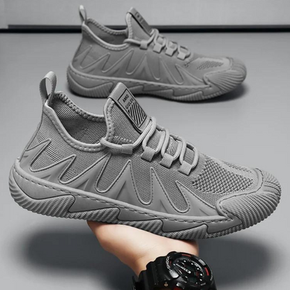 Grauer Sneaker für Herren, atmungsaktiv, rutschfest, sportlich, modisch, bequem.