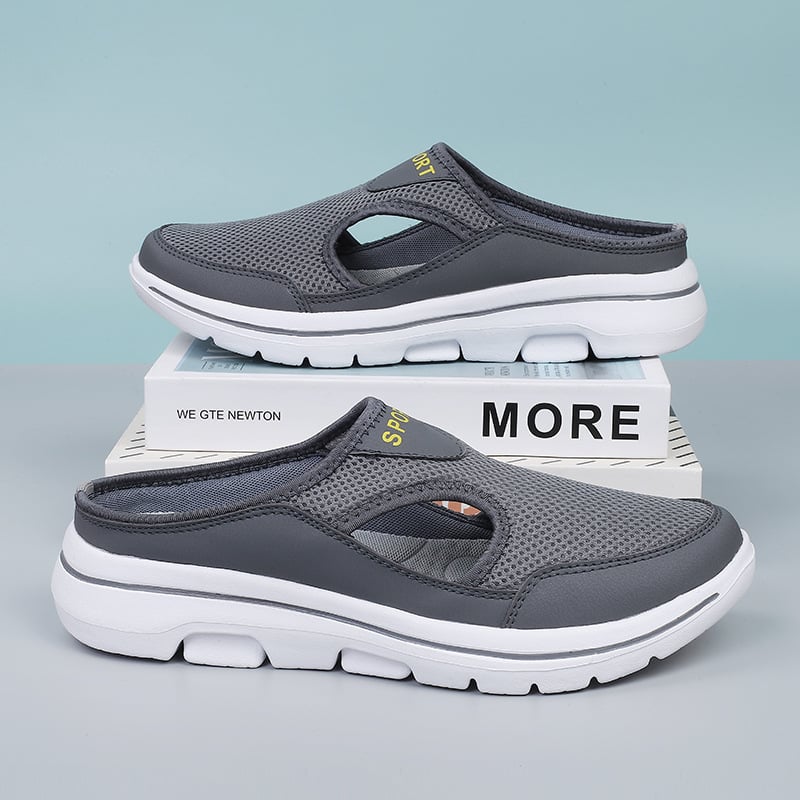 Graue Herren-Sportschuhe, atmungsaktiv, rutschfest, mit weißer Sohle, ideal für Freizeitaktivitäten.