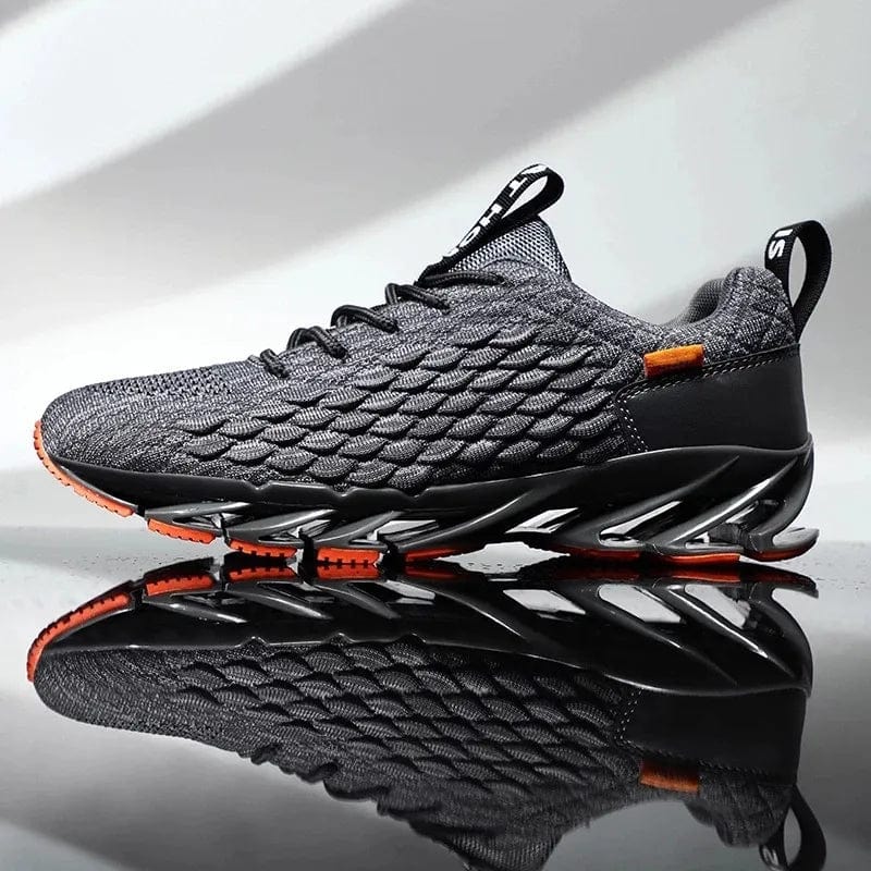 Grauer Sportschuh mit orangen Akzenten, atmungsaktives Mesh, rutschfeste Sohle, Herren Sneaker.