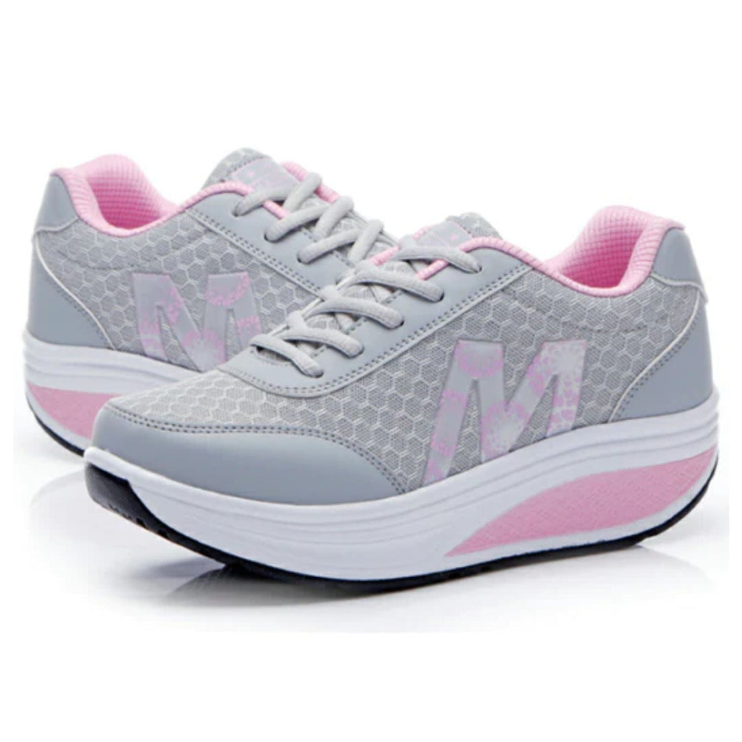 Graue und rosa Damen-Sneaker mit gepolsterter Sohle, atmungsaktiv, sportlich, bequem.