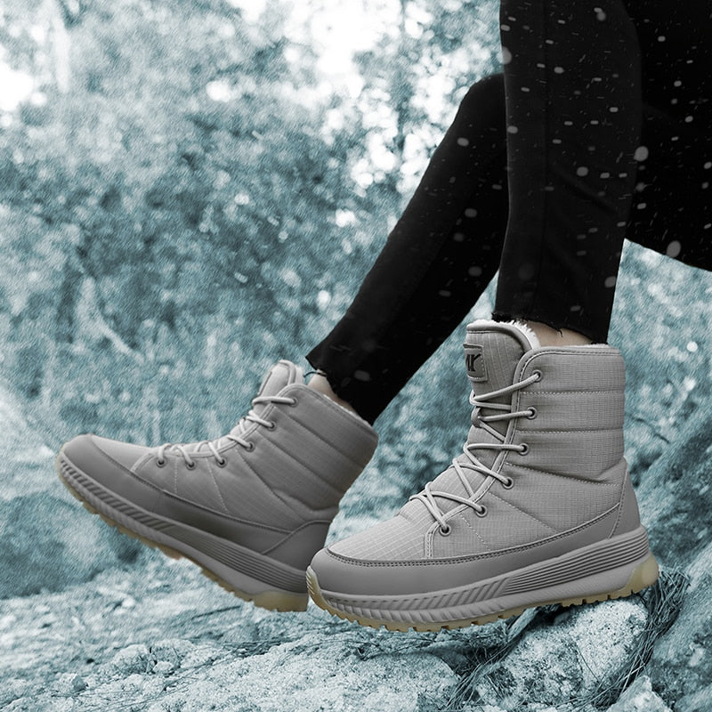 Graue wasserdichte Winterstiefel für Damen, rutschfest, warm, ideal für Outdoor-Aktivitäten.