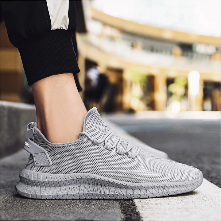 Grauer Herren-Sneaker aus Mesh, atmungsaktiv, sportlich, ideal für Laufen und Freizeit.