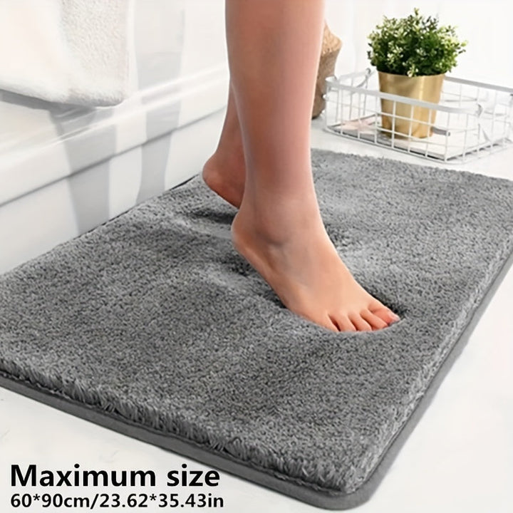 Grauer rutschfester Badezimmerteppich, Memory-Schaum, 60x90 cm, weiche Oberfläche, Fußabdruck.