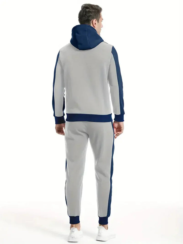 Grauer Herren-Trainingsanzug mit blauen Streifen, Kapuze, sportlich, bequem.