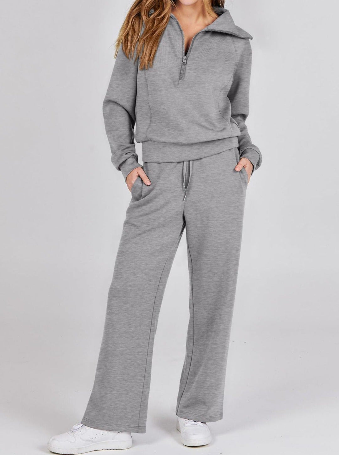 Grauer Damen-Jogginganzug, langärmelig, mit Reißverschluss, bequem, Freizeitmode.