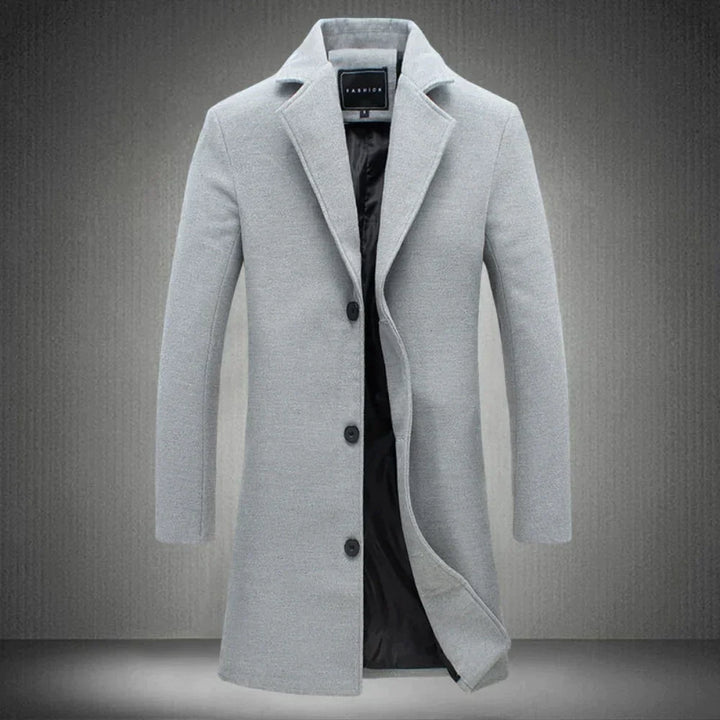 Grauer Herrenmantel, elegantes Design, Knopfverschluss, Wintermode, hochwertiger Wollstoff.