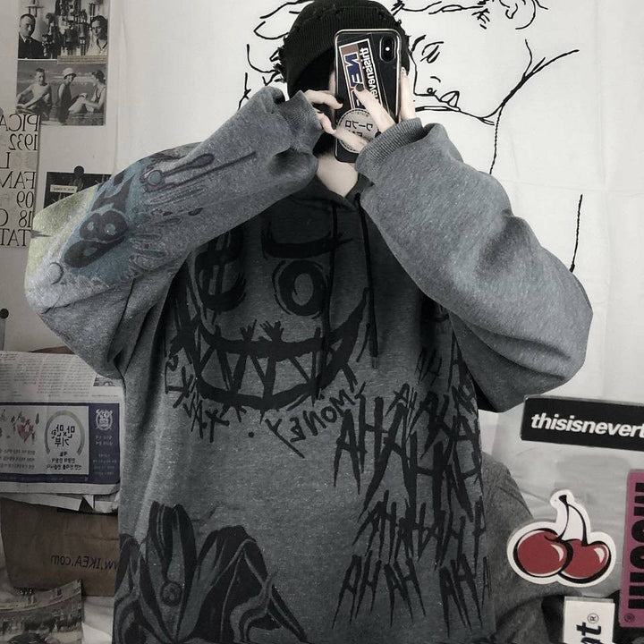 Grauer Oversize-Pullover mit schwarzem Graffiti-Design, Unisex Streetwear, Baumwolle.