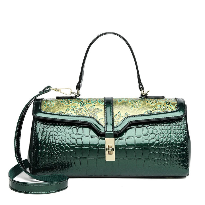 Grüne Krokodilleder-Handtasche mit goldener Verzierung, elegantes Design, Damenmode.