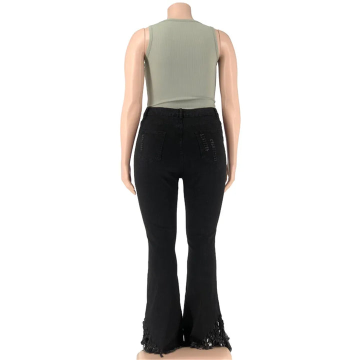Damenmode: Schwarze Schlaghose mit Spitze, grünes ärmelloses Top, Rückansicht.