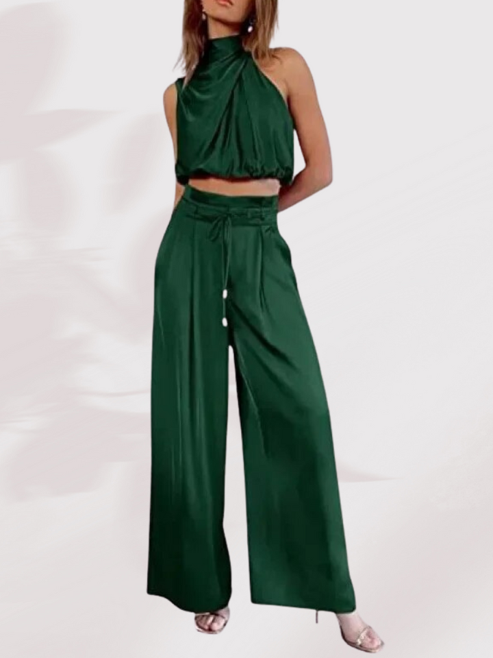 Grünes Damen-Zweiteiler-Set, ärmelloses Oberteil, weite Hose, elegantes Outfit.
