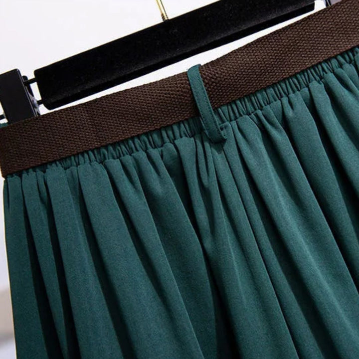 Grüner Faltenrock mit braunem Bund, Damenmode, eleganter Stil, knielang, Baumwolle.
