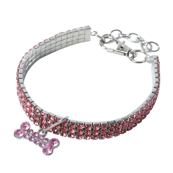 Rosa Hundehalsband mit Strasssteinen und Knochenanhänger, verstellbar, modisch.