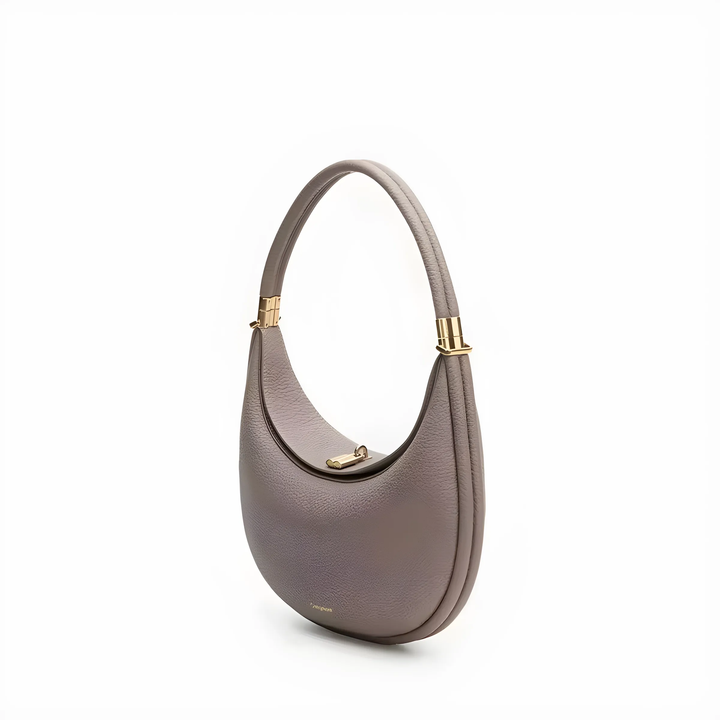 Luxuriöse graue Lederhandtasche mit goldenen Akzenten, elegantes Design, vielseitig einsetzbar.