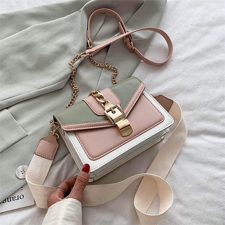 Damenhandtasche aus Leder, mehrfarbig, mit Kettengurt und Schnalle, modisch und elegant.