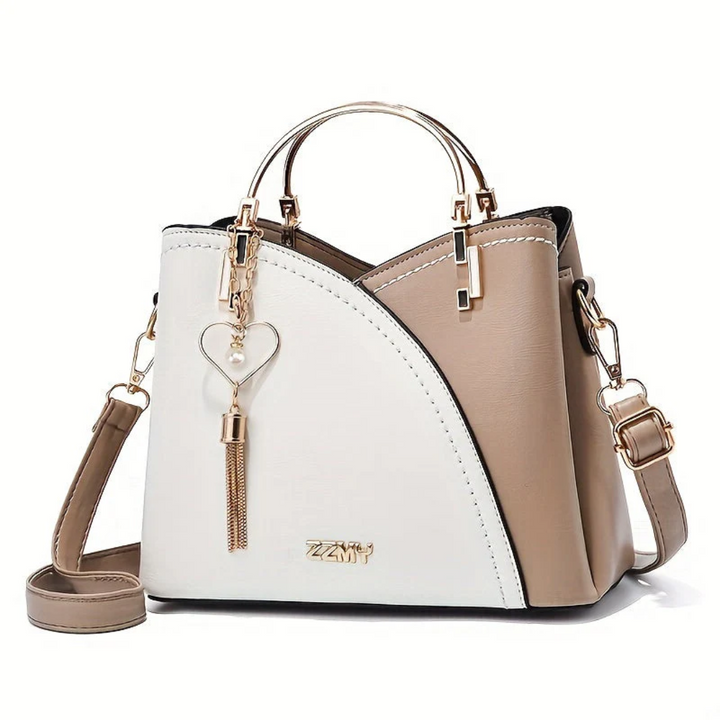 Damenhandtasche zweifarbig beige-weiß, Kunstleder, Herzanhänger, Schulterriemen.