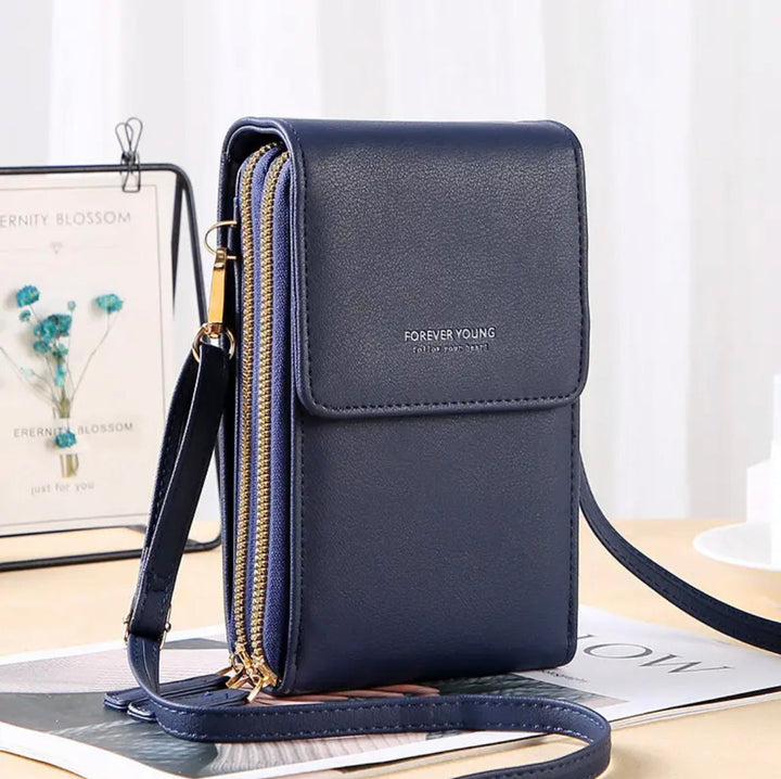 Dunkelblaue Lederhandtasche mit Reißverschluss, Umhängegurt, elegant, modisch, Damenaccessoire.