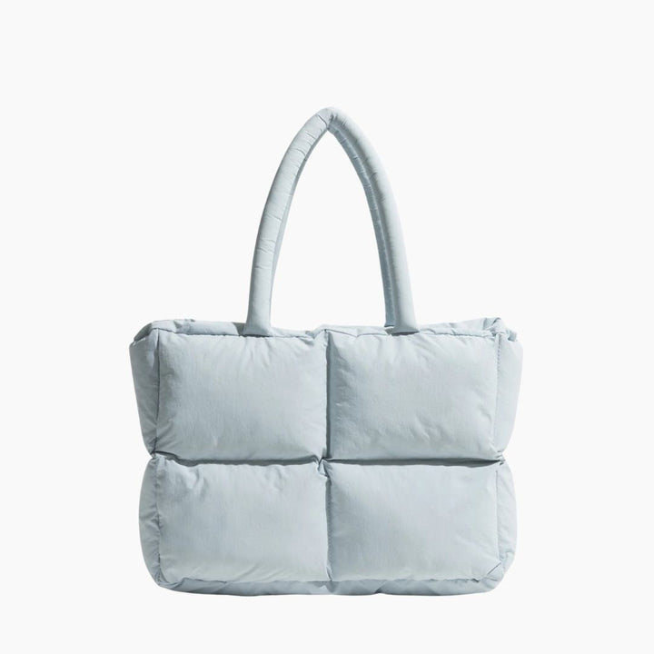 Hellblaue gesteppte Handtasche, Damenmode, modisches Accessoire, elegantes Design, Einkaufstasche.