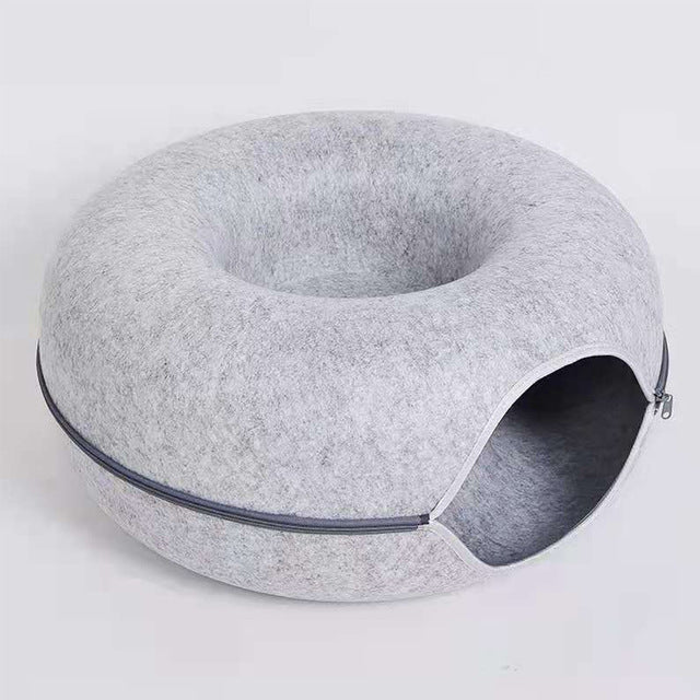 Hellgraues Katzenbett aus Filz mit Reißverschluss, rundes Design, gemütlicher Schlafplatz.