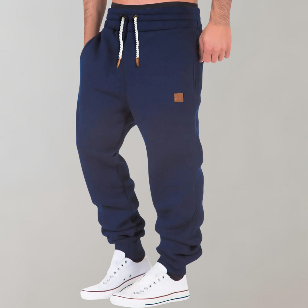 Dunkelblaue Herren-Jogginghose mit Kordelzug, Baumwolle, sportlich, bequem, modisch.