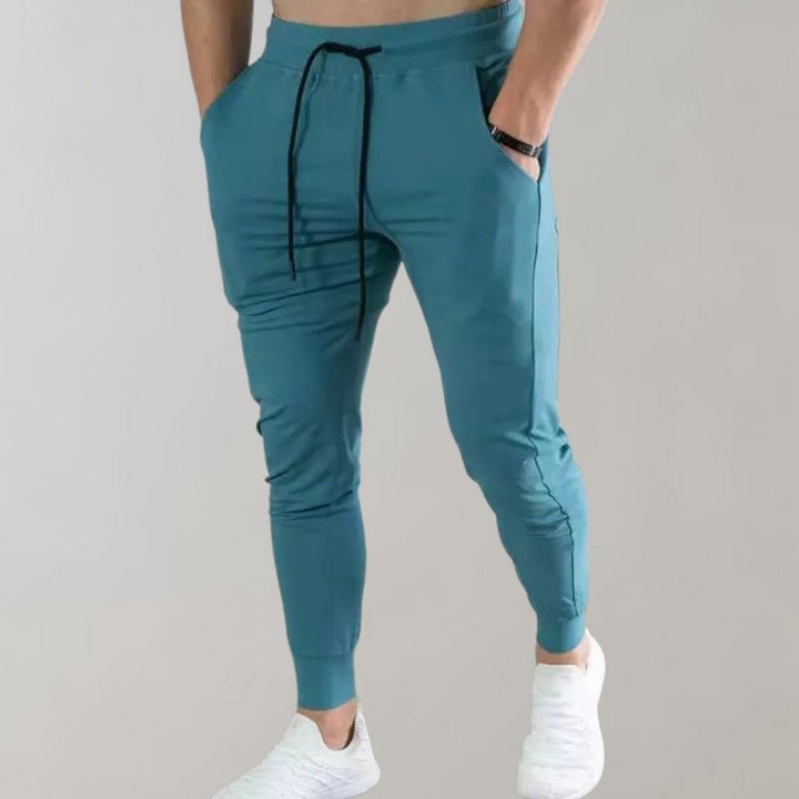 Blaue Herren-Jogginghose, sportlich, bequem, mit Kordelzug, ideal für Fitness und Freizeit.