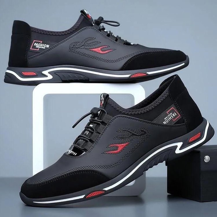 Schwarze Herrenschuhe, stilvoll und bequem, mit roten Akzenten und sportlichem Design.