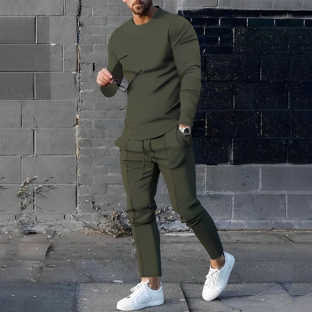 Grüner Herren-Sportanzug, langärmeliges Shirt und Hose, ideal für Jogging und Fitness.