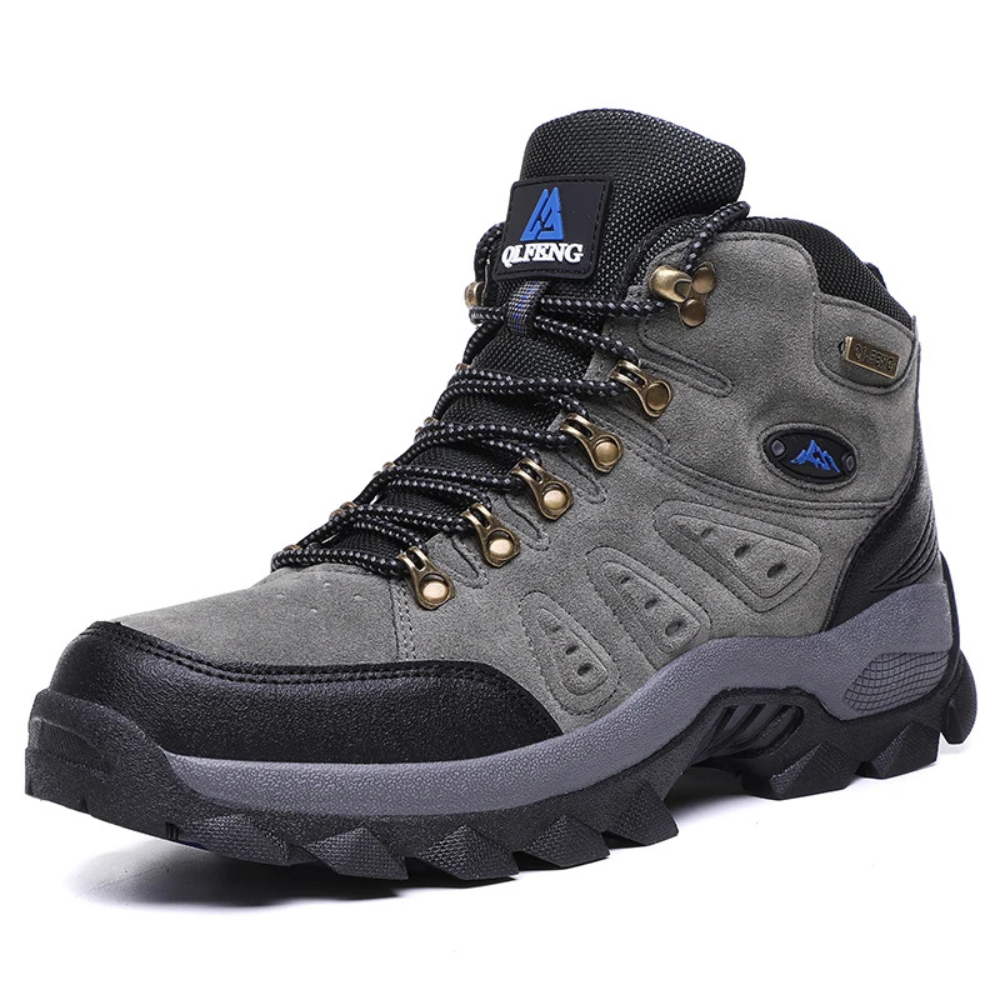 Grauer Wanderschuh aus Leder, wasserdicht, rutschfeste Sohle, ideal für Outdoor-Aktivitäten.