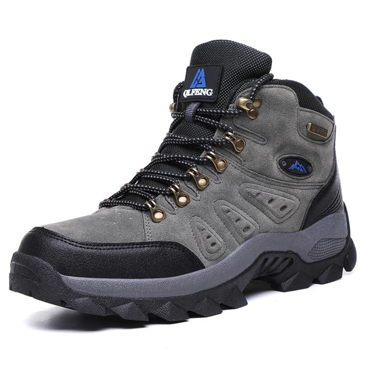 Grauer Wanderschuh aus Leder, wasserdicht, rutschfeste Sohle, ideal für Outdoor-Aktivitäten.