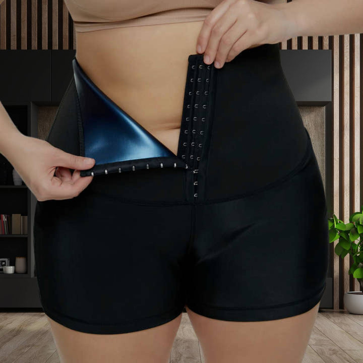 Frau in schwarzer Sauna-Sweathose mit Taillentrainer, Shapewear, Fettverbrennung, Fitness.