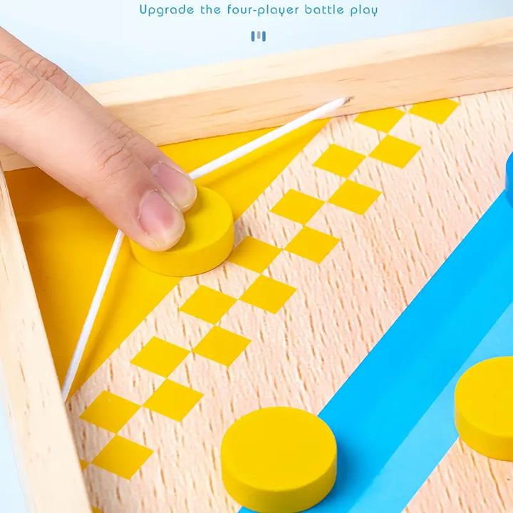 Holzspielzeug, gelbe Scheiben, Fingerschleuder, Geschicklichkeitsspiel, Kinder, Tischspiel.
