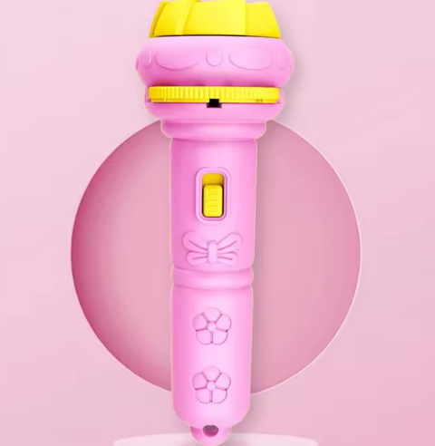 Rosa Kinder-Mikrofon mit gelbem Kopf, Spielzeug, Kunststoff, Geschenkidee, Musikspielzeug.