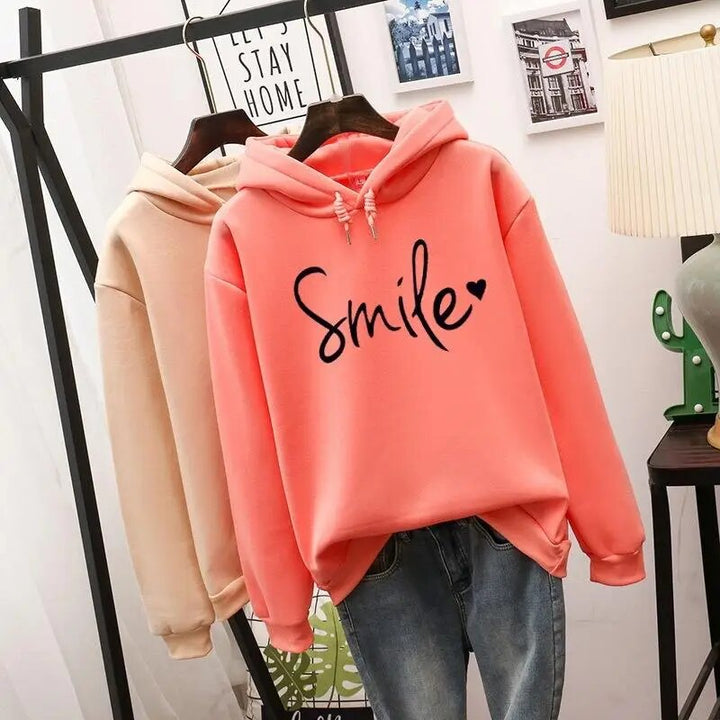 Rosa Kapuzenpullover mit "Smile"-Aufdruck, lange Ärmel, lässig, Damenmode, Baumwolle.