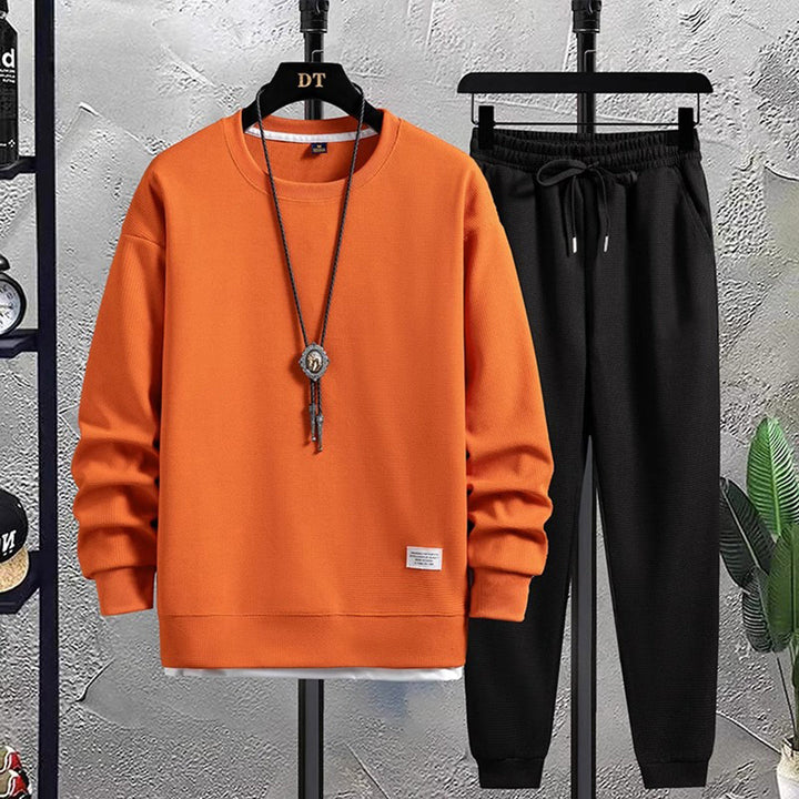 Orange Herren-Jogginganzug, Baumwolle, Freizeitmode, bequemer Sportanzug, modisches Design.