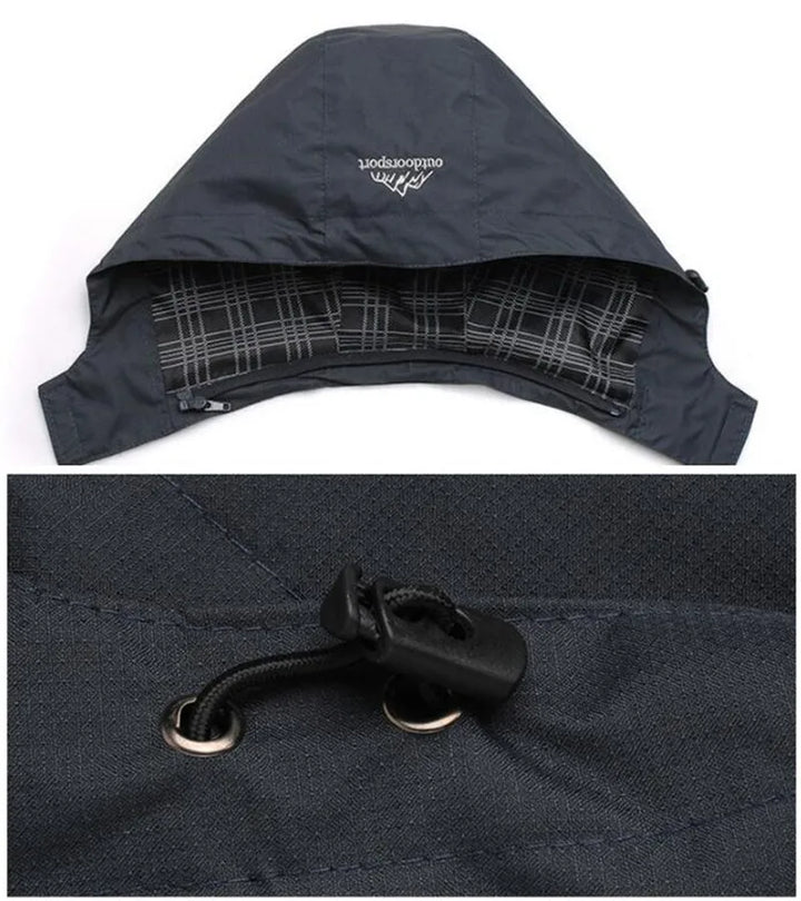 Schwarze Outdoor-Kapuzenjacke mit Kordelzug, kariertes Innenfutter, wetterfest.