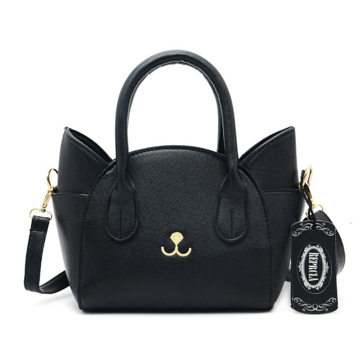 Schwarze Katzenhandtasche aus Leder mit abnehmbarem Schulterriemen und goldenen Details.