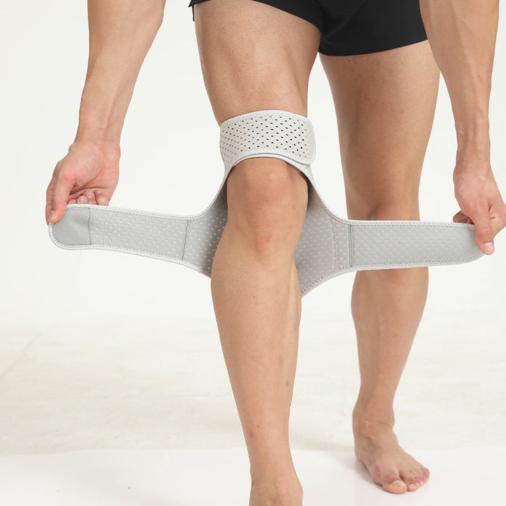 Graue Kniebandage für Sport, verstellbar, atmungsaktiv, Unterstützung, Verletzungsprävention.