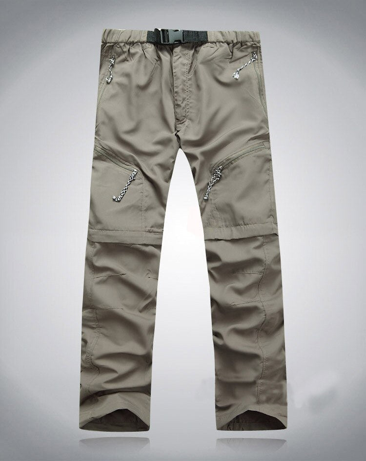 Beige Outdoor-Hose, elastisch, mit Reißverschlusstaschen, ideal für Wandern und Trekking.