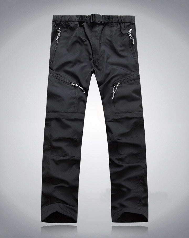 Schwarze Outdoor-Performance-Hose mit Reißverschlusstaschen und verstellbarem Bund.